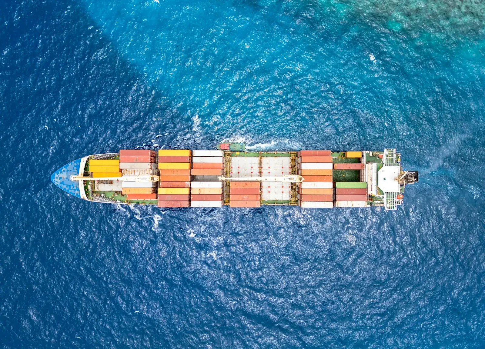 Container ship crossing open ocean